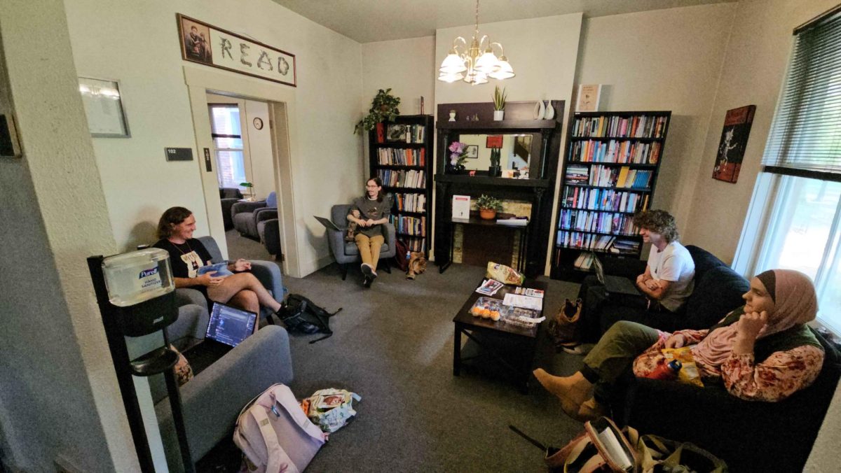 Members of The Coroners sitting in the English Department lounge